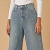Jeans a palazzo ricoperti di brillantini Luméa